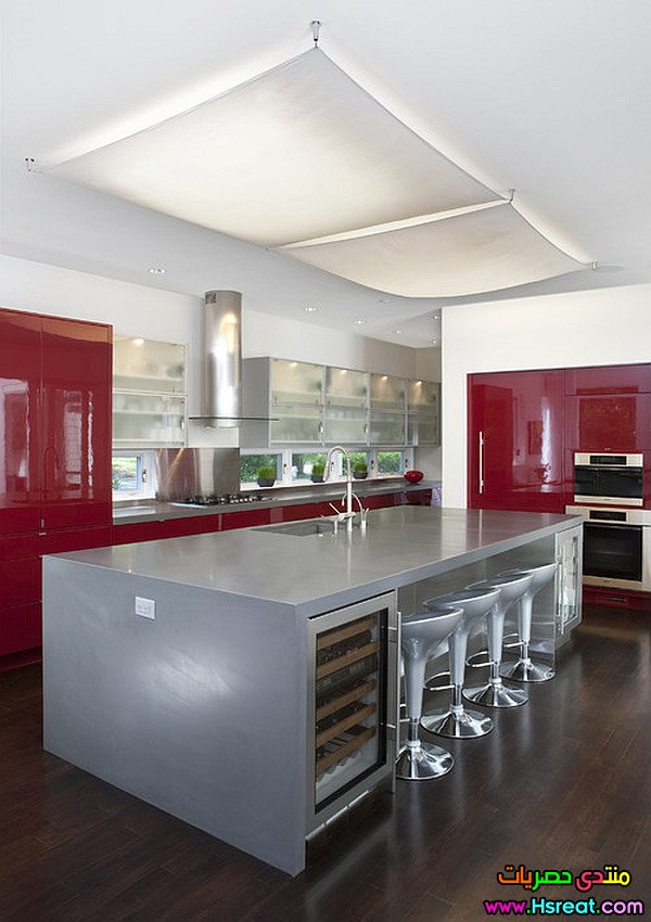 glossy-dark-red-cabinets-and-silver-kitchen-island.jpg